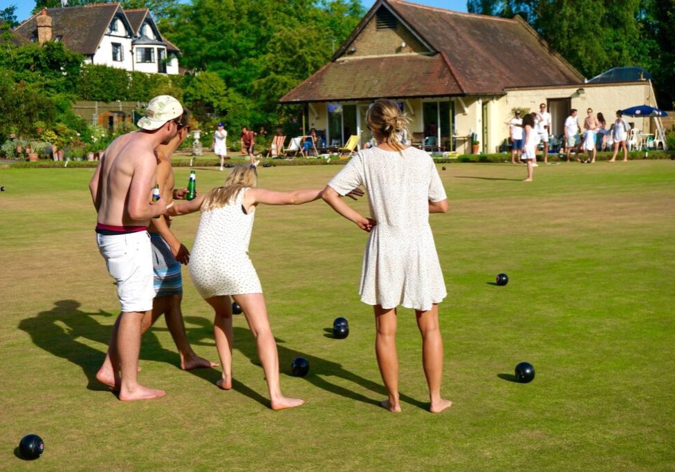Messing about on the green dressed in whites